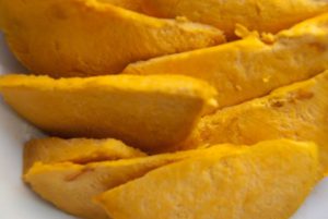 sliced lucuma fruit without skin