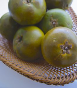 whole lucuma fruit with skin