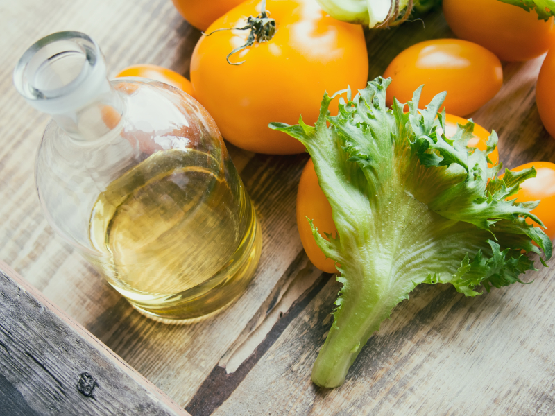 Components for salad: tomatoes, frillis and oil