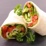 tomato basil wrap with queso fresco and avocado