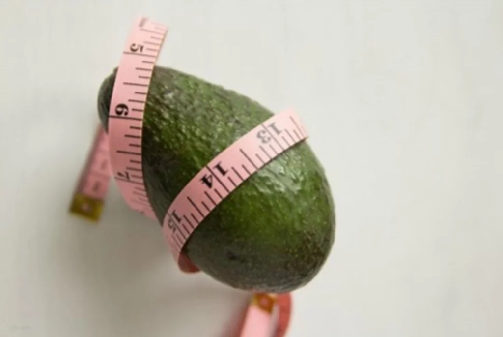 Avocado with tape measurer